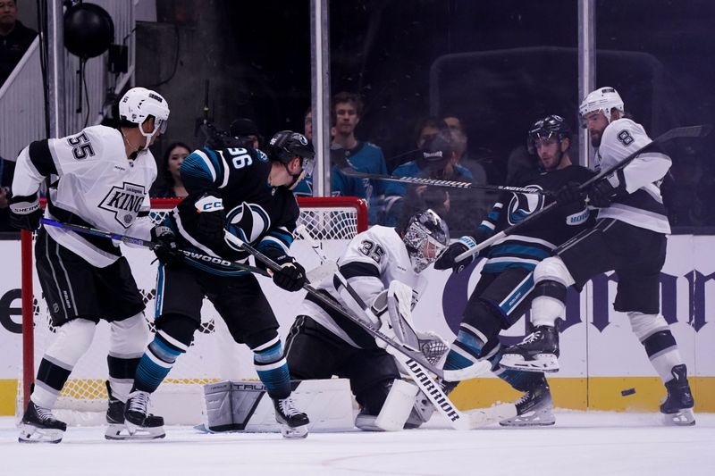 Oct 28, 2025; San Jose, California, USA; Los Angeles Kings goalie Darcy Kuemper (35), right winger Quinton Byfield (55), and defenseman Drew Doughty (8) defend the goal against San Jose Sharks center Philipp Kurashev (96) in the second period at SAP Center at San Jose. Mandatory Credit: David Gonzales-Imagn Images