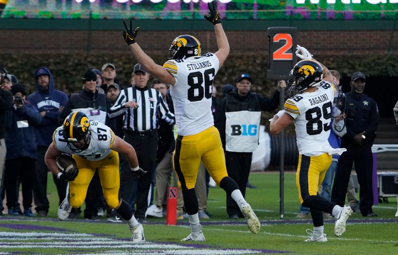 Nov 4, 2023; Chicago, Illinois, USA; Iowa Hawkeyes tight end Addison Ostrenga (87) catches a touchdown pass against the Northwestern Wildcats during the second half at Wrigley Field. Mandatory Credit: David Banks-USA TODAY Sports