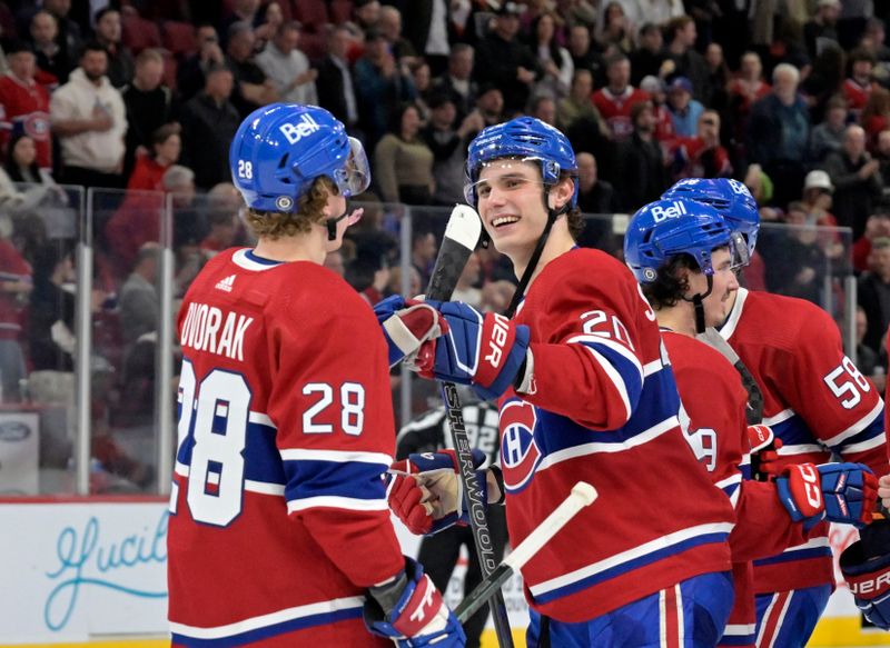 Apr 9, 2024; Montreal, Quebec, CAN; Montreal Canadiens forward Christian Dvorak (28) and teammate forward Juraj Slafkovsky (20) celebrate the win against the Philadelphia Flyers at the Bell Centre. Mandatory Credit: Eric Bolte-USA TODAY Sports