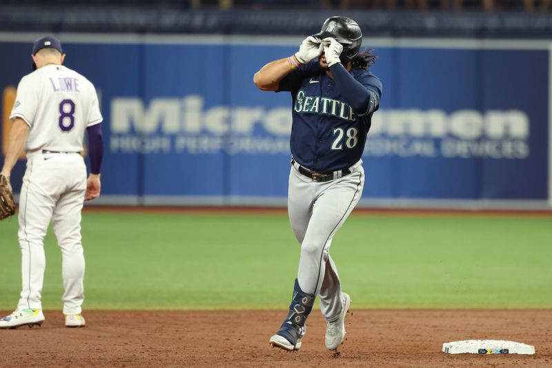 Sep 8, 2023; St. Petersburg, Florida, USA; Seattle Mariners third baseman Eugenio Suarez (28)] celebrates after he hit a home run against the Tampa Bay Rays during the second inning  at Tropicana Field. Mandatory Credit: Kim Klement Neitzel-USA TODAY Sports