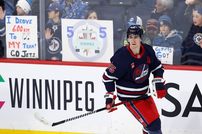 Apr 2, 2023; Winnipeg, Manitoba, CAN; Winnipeg Jets center Mark Scheifele (55) skates past fans before a game against the New Jersey Devils at Canada Life Centre. Mandatory Credit: James Carey Lauder-USA TODAY Sports