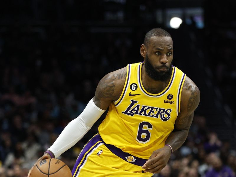 CHARLOTTE, NORTH CAROLINA - JANUARY 02: LeBron James #6 of the Los Angeles Lakers dribbles during the second half of the game against the Charlotte Hornets at Spectrum Center on January 02, 2023 in Charlotte, North Carolina. NOTE TO USER: User expressly acknowledges and agrees that, by downloading and or using this photograph, User is consenting to the terms and conditions of the Getty Images License Agreement. (Photo by Jared C. Tilton/Getty Images)