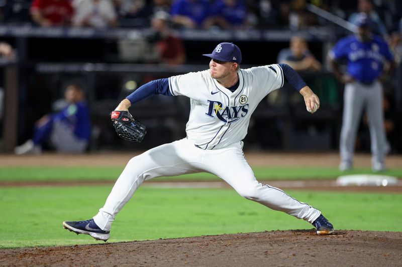 Sep 15, 2025; Tampa, Florida, USA; Tampa Bay Rays pitcher Garrett Cleavinger (60) throws a pitch against the Toronto Blue Jays in the seventh inning at George M. Steinbrenner Field. Mandatory Credit: Nathan Ray Seebeck-Imagn Images