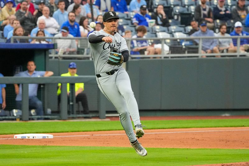 May 6, 2025; Kansas City, Missouri, USA; Chicago White Sox third base Miguel Vargas (20) fields a bunt and throws to first base against the Kansas City Royals in the third inning at Kauffman Stadium. Mandatory Credit: Denny Medley-Imagn Images