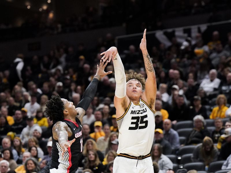 Jan 6, 2024; Columbia, Missouri, USA; Missouri Tigers forward Noah Carter (35) shoots a three point shot as Georgia Bulldogs guard Justin Hill (11) defends during the first half at Mizzou Arena. Mandatory Credit: Denny Medley-USA TODAY Sports