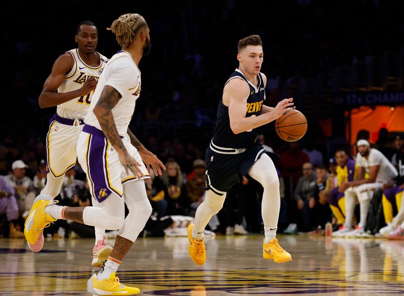 LOS ANGELES, CALIFORNIA - NOVEMBER 23:  Christian Braun #0 of the Denver Nuggets in the first half at Crypto.com Arena on November 23, 2024 in Los Angeles, California.  NOTE TO USER: User expressly acknowledges and agrees that, by downloading and/or using this photograph, user is consenting to the terms and conditions of the Getty Images License Agreement. (Photo by Ronald Martinez/Getty Images)