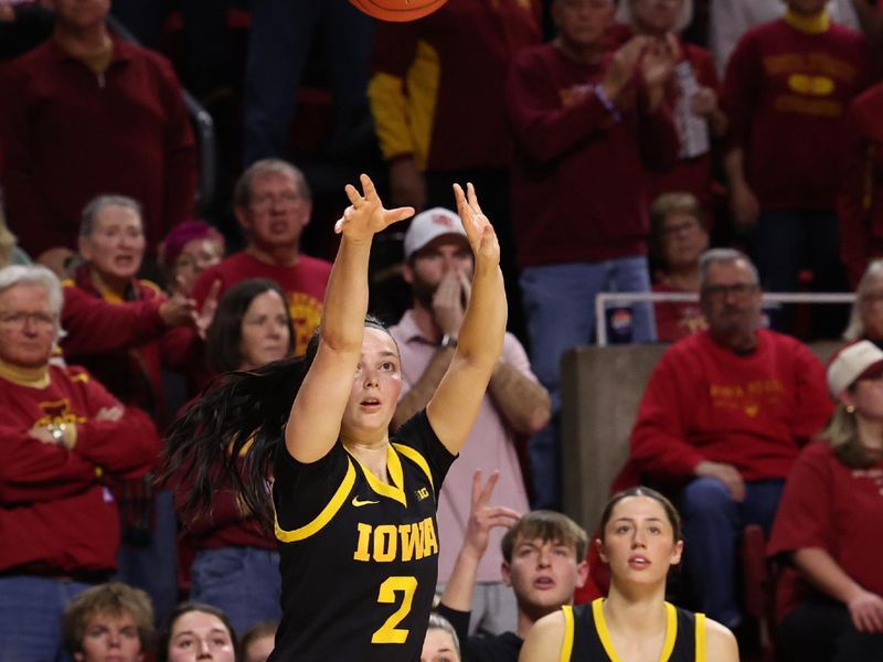 Dec 10, 2025; Ames, Iowa, USA;  Iowa Hawkeyes Taylor McCabe (2) shoots against the Iowa State Cyclones during the second half at James H. Hilton Coliseum. Mandatory Credit: Reese Strickland-Imagn Images