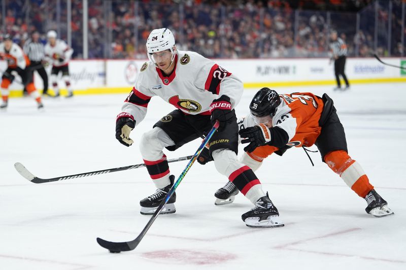 Nov 8, 2025; Philadelphia, Pennsylvania, USA; Ottawa Senators center Dylan Cozens (24) controls the puck against Philadelphia Flyers right wing Matvei Michkov (39) in the third period at Xfinity Mobile Arena. Mandatory Credit: Kyle Ross-Imagn Images
