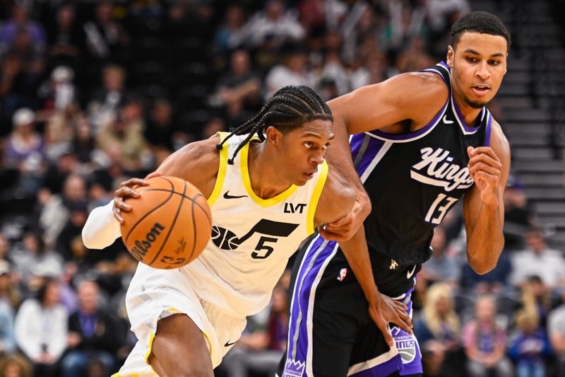 SALT LAKE CITY, UTAH - OCTOBER 15: Cody Williams #5 of the Utah Jazz drives into Keegan Murray #13 of the Sacramento Kings during the second half of a preseason game at Delta Center on October 15, 2024 in Salt Lake City, Utah. NOTE TO USER: User expressly acknowledges and agrees that, by downloading and or using this photograph, User is consenting to the terms and conditions of the Getty Images License Agreement. (Photo by Alex Goodlett/Getty Images)