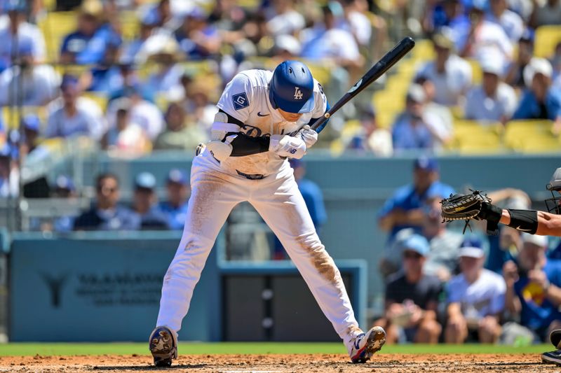 Aug 31, 2025; Los Angeles, California, USA; Los Angeles Dodgers designated hitter Shohei Ohtani (17) backs off an inside pitch during the second inning at Dodger Stadium. Mandatory Credit: Jayne Kamin-Oncea-Imagn Images
