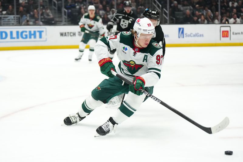 Apr 15, 2024; Los Angeles, California, USA; Minnesota Wild left wing Kirill Kaprizov (97) pursues the puck against LA Kings defenseman Mikey Anderson (44) in the first period at Crypto.com Arena. Mandatory Credit: Kirby Lee-USA TODAY Sports