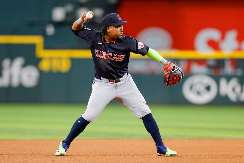 May 15, 2024; Arlington, Texas, USA; Cleveland Guardians third base Jose Ramírez (11) sets to throw during the fifth inning against the Texas Rangers at Globe Life Field. Mandatory Credit: Andrew Dieb-USA TODAY Sports