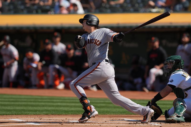 Aug 5, 2023; Oakland, California, USA; San Francisco Giants designated hitter Wilmer Flores (41) hits a single against the Oakland Athletics during the first inning at Oakland-Alameda County Coliseum. Mandatory Credit: Darren Yamashita-USA TODAY Sports