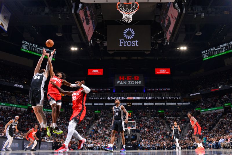 SAN ANTONIO, TX - MARCH 12: Sandro Mamukelashvili #54 of the San Antonio Spurs  rebounds the ball during the game against the Houston Rockets on March 12, 2024 at the Frost Bank Center in San Antonio, Texas. NOTE TO USER: User expressly acknowledges and agrees that, by downloading and or using this photograph, user is consenting to the terms and conditions of the Getty Images License Agreement. Mandatory Copyright Notice: Copyright 2024 NBAE (Photos by Jesse D. Garrabrant/NBAE via Getty Images)