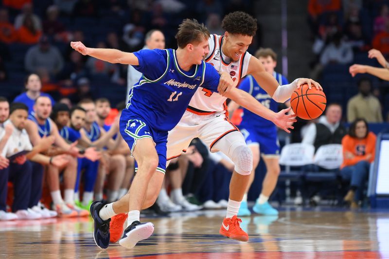 Dec 17, 2025; Syracuse, New York, USA; Mercyhurst Lakers guard Jake Lemelman (11) reaches for the ball controlled by Syracuse Orange guard Naithan George (11) during the second half at the JMA Wireless Dome. Mandatory Credit: Rich Barnes-Imagn Images