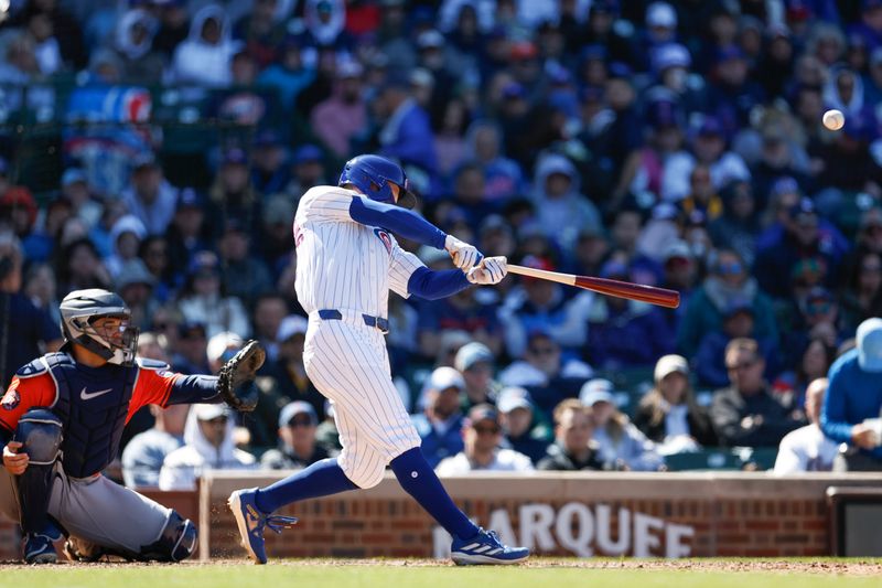 Apr 25, 2024; Chicago, Illinois, USA; Chicago Cubs centerfielder Pete Crow-Armstrong (52) hits a two-run home run against the Houston Astros during the sixth inning at Wrigley Field. Mandatory Credit: Kamil Krzaczynski-USA TODAY Sports