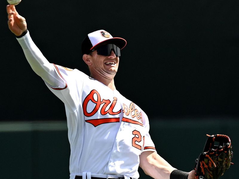 Feb 27, 2023; Sarasota, Florida, USA; Baltimore Orioles left fielder Austin Hayes (21) warms up before the start of the spring training game against the Tampa Bay Rays at Ed Smith Stadium. Mandatory Credit: Jonathan Dyer-USA TODAY Sports