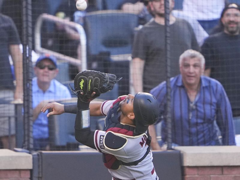 Sep 14, 2023; New York City, New York, USA; Arizona Diamondbacks catcher Gabriel Moreno (14) catches a foul ball hit by New York Mets second baseman Jeff McNeil (not pictured) during the second inning at Citi Field. Mandatory Credit: Gregory Fisher-USA TODAY Sports