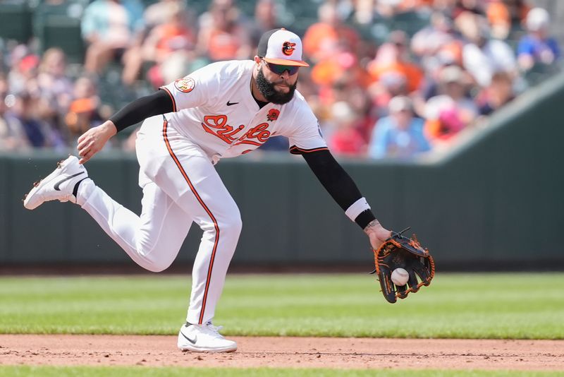 May 26, 2025; Baltimore, Maryland, USA; Baltimore Orioles third baseman Emmanuel Rivera (26) fields a ground ball hit by St. Louis Cardinals shortstop Masyn Winn (0) (not pictured) during the third inning at Oriole Park at Camden Yards. Mandatory Credit: Gregory Fisher-Imagn Images