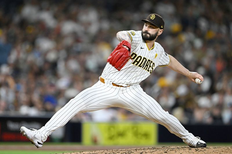 Aug 19, 2024; San Diego, California, USA; San Diego Padres relief pitcher Tanner Scott (66) pitches during the seventh inning against the Minnesota Twins at Petco Park. Mandatory Credit: Denis Poroy-USA TODAY Sports