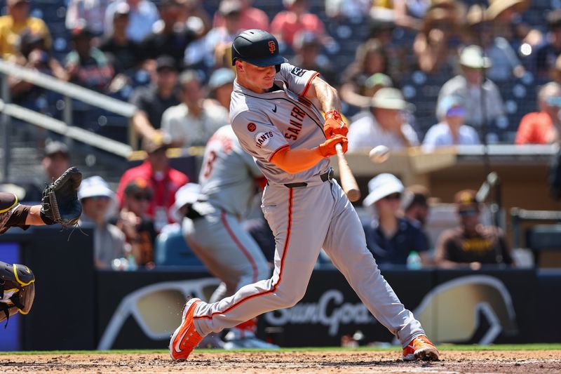 Sep 8, 2024; San Diego, California, USA; San Francisco Giants third baseman Matt Chapman (26) hits a two run home run during the fourth inning against the San Diego Padres at Petco Park. Mandatory Credit: Chadd Cady-Imagn Images