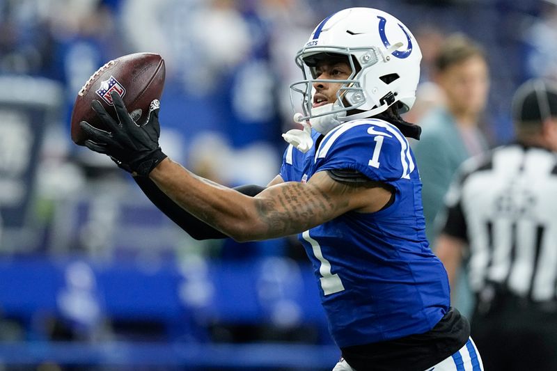 Indianapolis Colts wide receiver Josh Downs (1) warms up before an NFL football game against the Houston Texans, Saturday, Jan. 6, 2024, in Indianapolis. (AP Photo/Darron Cummings)