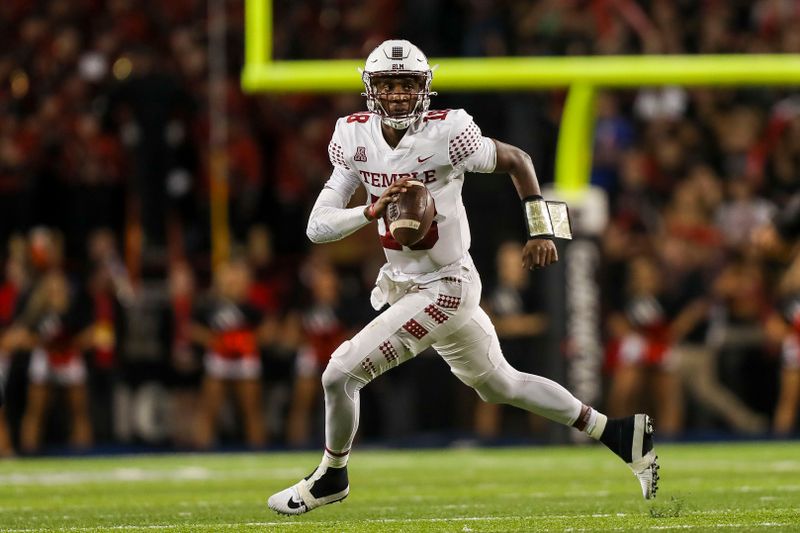 Oct 8, 2021; Cincinnati, Ohio, USA; Temple Owls quarterback D'Wan Mathis (18) runs with the ball against the Cincinnati Bearcats in the first half at Nippert Stadium. Mandatory Credit: Katie Stratman-USA TODAY Sports