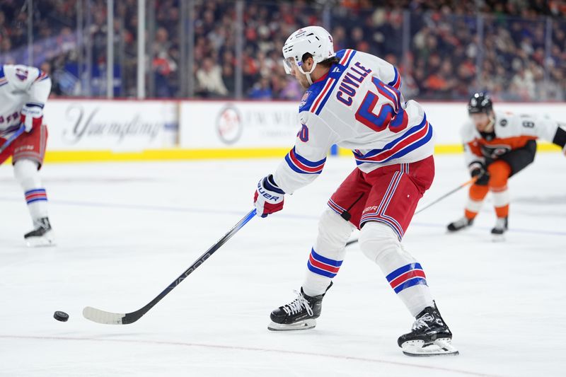 Jan 17, 2026; Philadelphia, Pennsylvania, USA; New York Rangers goalie Igor Shesterkin (50) passes for an assist on a goal against the Philadelphia Flyers in the first period at Xfinity Mobile Arena. Mandatory Credit: Kyle Ross-Imagn Images
