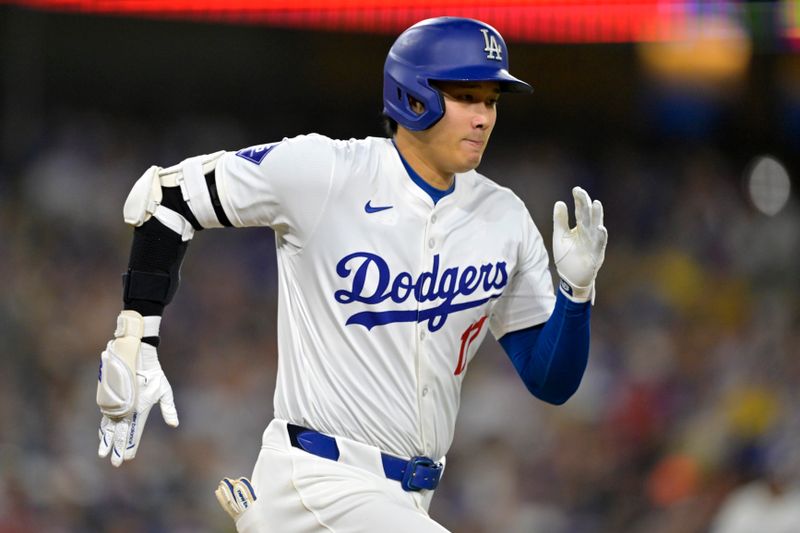 Jun 21, 2024; Los Angeles, California, USA;  Los Angeles Dodgers designated hitter Shohei Ohtani (17) runs out an infield hit in the eighth inning against the Los Angeles Angels at Dodger Stadium. Mandatory Credit: Jayne Kamin-Oncea-USA TODAY Sports