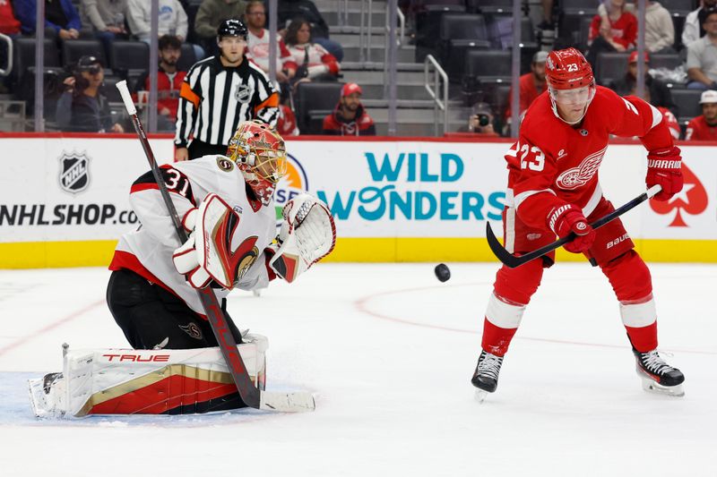 Oct 4, 2024; Detroit, Michigan, USA;  Ottawa Senators goaltender Anton Forsberg (31) makes a save on Detroit Red Wings left wing Lucas Raymond (23) in the second period at Little Caesars Arena. Mandatory Credit: Rick Osentoski-Imagn Images