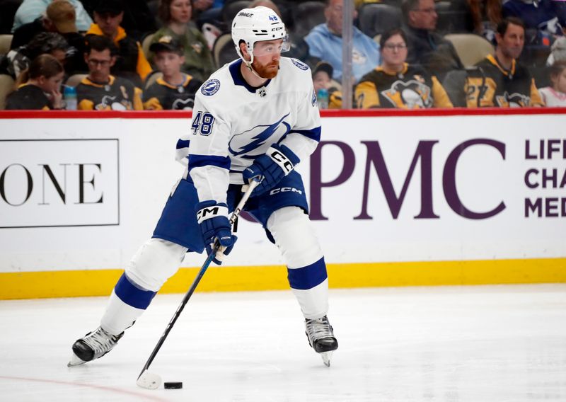 Apr 6, 2024; Pittsburgh, Pennsylvania, USA;  Tampa Bay Lightning defenseman Nick Perbix (48) handles the puck against the Pittsburgh Penguins during the third period at PPG Paints Arena. The Penguins won 5-4. Mandatory Credit: Charles LeClaire-USA TODAY Sports