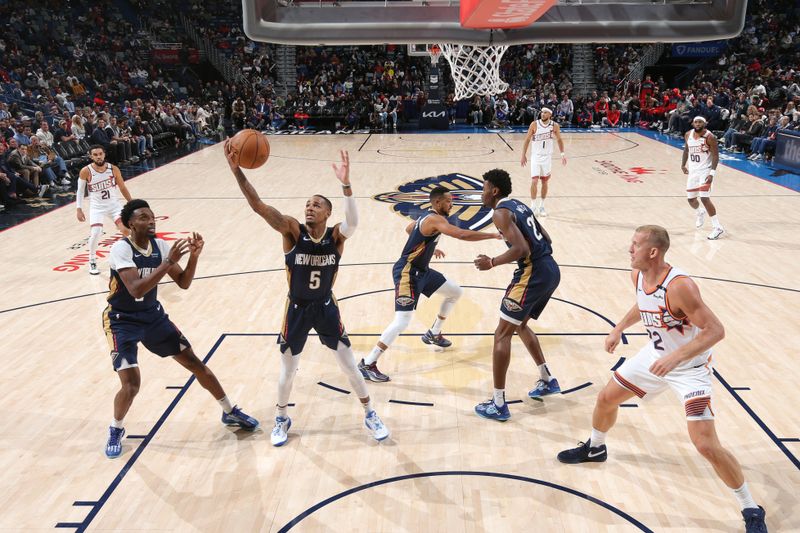 NEW ORLEANS, LA - DECEMBER 5: Dejounte Murray #5 of the New Orleans Pelicans grabs the rebound during the game against the Phoenix Suns on December 5, 2024 at the Smoothie King Center in New Orleans, Louisiana. NOTE TO USER: User expressly acknowledges and agrees that, by downloading and or using this Photograph, user is consenting to the terms and conditions of the Getty Images License Agreement. Mandatory Copyright Notice: Copyright 2024 NBAE (Photo by Layne Murdoch Jr./NBAE via Getty Images)