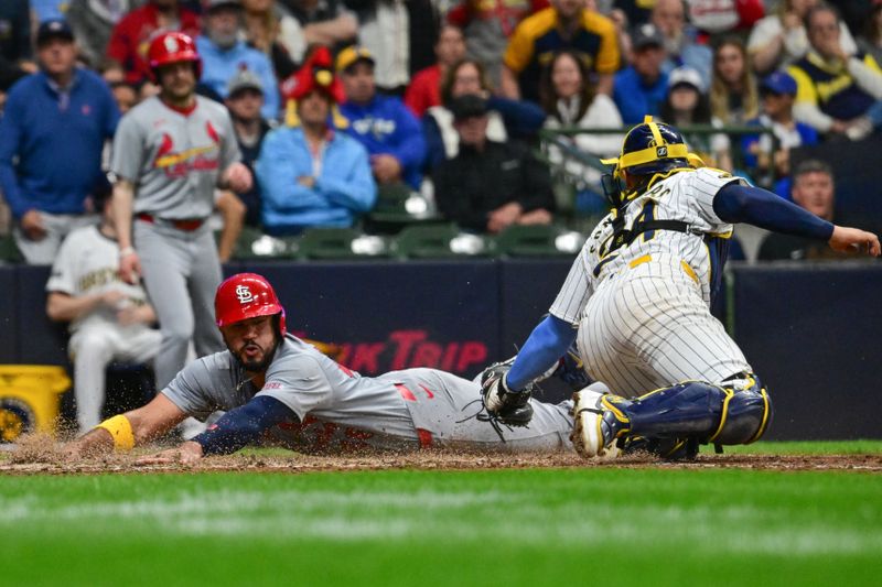 May 11, 2024; Milwaukee, Wisconsin, USA; St. Louis Cardinals catcher Ivan Herrera (48) scores against Milwaukee Brewers catcher William Contreras (24) in the sixth inning at American Family Field. Mandatory Credit: Benny Sieu-USA TODAY Sports