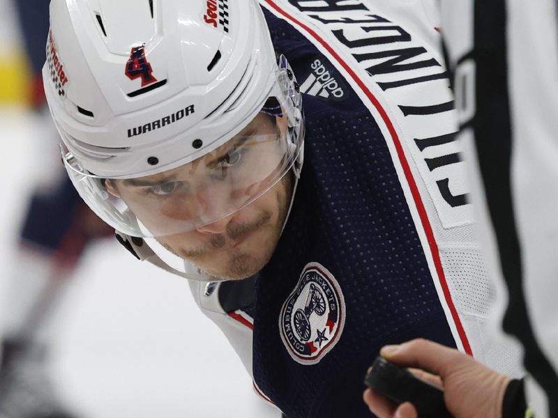 Nov 11, 2023; Detroit, Michigan, USA;  Columbus Blue Jackets center Cole Sillinger (4) prepares to face off against the Detroit Red Wings in the third period at Little Caesars Arena. Mandatory Credit: Rick Osentoski-USA TODAY Sports