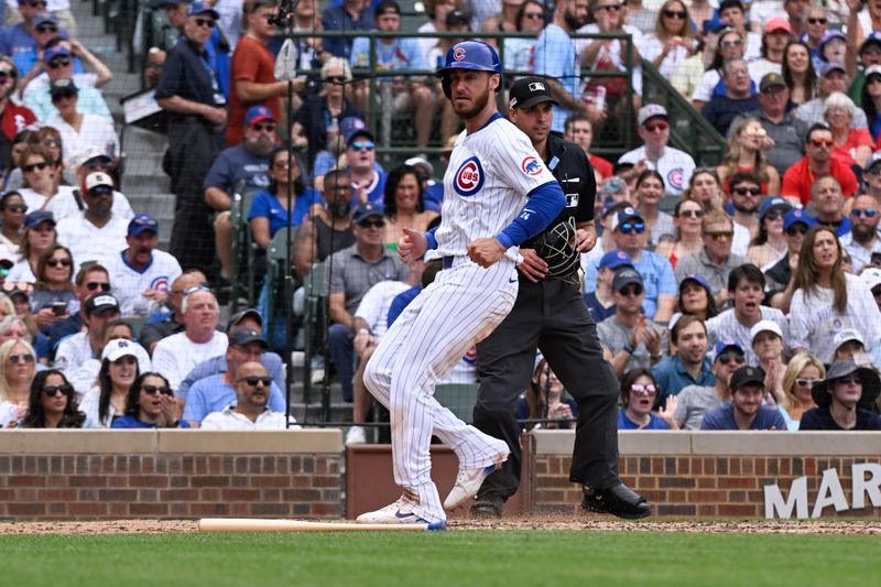 Jun 15, 2024; Chicago, Illinois, USA;  Chicago Cubs outfielder Cody Bellinger (24) scores against the St. Louis Cardinals during the fourth inning at Wrigley Field. Mandatory Credit: Matt Marton-USA TODAY Sports