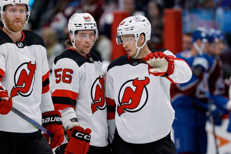 Nov 7, 2023; Denver, Colorado, USA; New Jersey Devils left wing Jesper Bratt (63) talks with left wing Erik Haula (56) in the third period against the Colorado Avalanche at Ball Arena. Mandatory Credit: Isaiah J. Downing-USA TODAY Sports