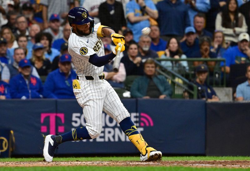Oct 2, 2024; Milwaukee, Wisconsin, USA; Milwaukee Brewers outfielder Jackson Chourio (11) hits a home run during the eighth inning in game two of the Wildcard round for the 2024 MLB Playoffs against the New York Mets at American Family Field. Mandatory Credit: Benny Sieu-Imagn Images