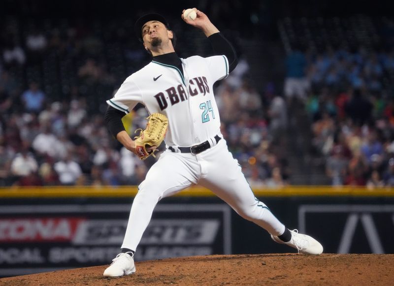 Jun 29, 2023; Phoenix, Arizona, USA; Diamondbacks relief pitcher Kyle Nelson (24) pitches against the Tampa Bay Rays at Chase Field. Mandatory Credit: Joe Rondone-USA TODAY Sports