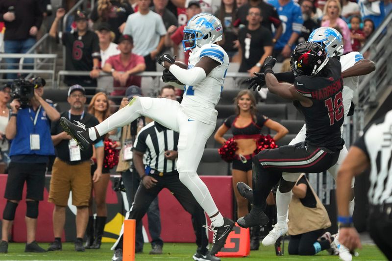 Detroit Lions safety Kerby Joseph (31) intercepts a pass intended for Arizona Cardinals wide receiver Marvin Harrison Jr. (18) during the second half of an NFL football game Sunday, Sept. 22, 2024, in Glendale, Ariz. (AP Photo/Rick Scuteri)