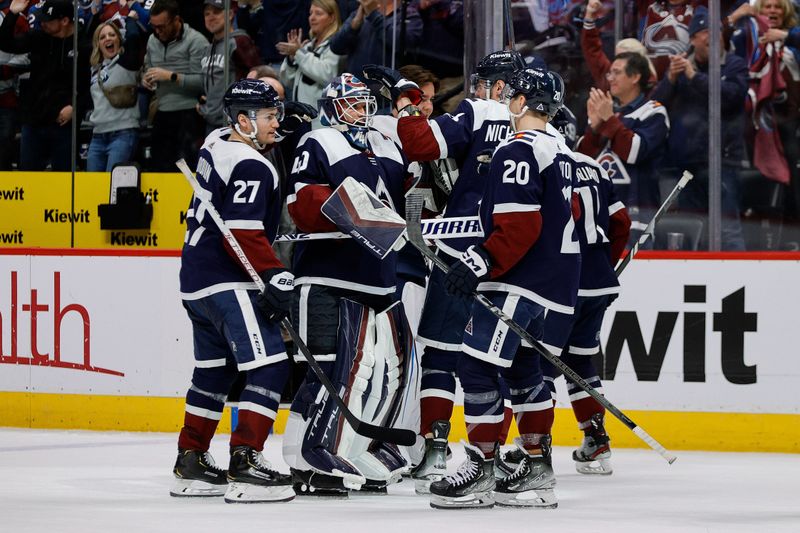 Mar 8, 2024; Denver, Colorado, USA; Colorado Avalanche goaltender Alexandar Georgiev (40) and right wing Valeri Nichushkin (13) and left wing Jonathan Drouin (27) and center Ross Colton (20) celebrate after the game against the Minnesota Wild at Ball Arena. Mandatory Credit: Isaiah J. Downing-USA TODAY Sports