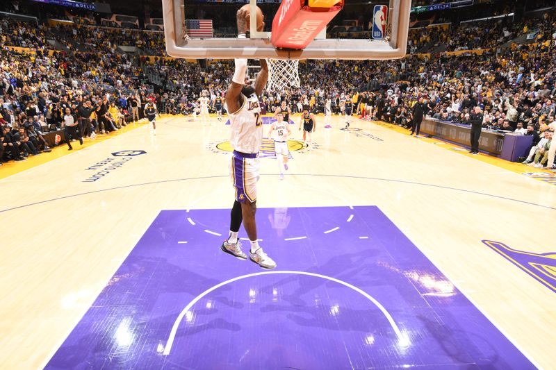 LOS ANGELES, CA - APRIL 27: LeBron James #23 of the Los Angeles Lakers dunks the ball during the game against the Denver Nuggets during Round 1 Game 4 of the 2024 NBA Playoffs on April 27, 2024 at Crypto.Com Arena in Los Angeles, California. NOTE TO USER: User expressly acknowledges and agrees that, by downloading and/or using this Photograph, user is consenting to the terms and conditions of the Getty Images License Agreement. Mandatory Copyright Notice: Copyright 2024 NBAE (Photo by Andrew D. Bernstein/NBAE via Getty Images)