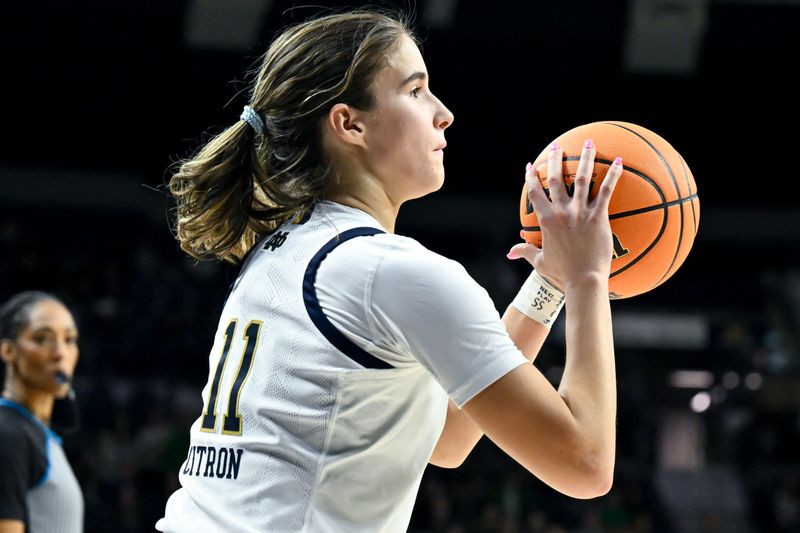 Jan 26, 2023; South Bend, Indiana, USA; Notre Dame Fighting Irish guard Sonia Citron (11) shoots a three point basket in the second half against the Florida State Seminoles at the Purcell Pavilion. Mandatory Credit: Matt Cashore-USA TODAY Sports