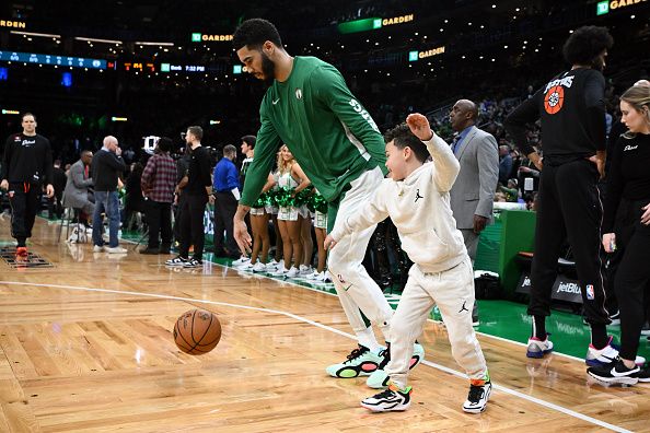 BOSTON, MASSACHUSETTS - DECEMBER 28: Jayson Tatum #0 of the Boston Celtics warmups with his son Deuce before a game against the Detroit Pistons at TD Garden on December 28, 2023 in Boston, Massachusetts. NOTE TO USER: User expressly acknowledges and agrees that, by downloading and or using this photograph, User is consenting to the terms and conditions of the Getty Images License Agreement. (Photo by Brian Fluharty/Getty Images)