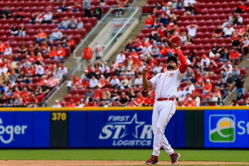 Apr 13, 2025; Cincinnati, Ohio, USA; Cincinnati Reds first baseman Jeimer Candelario (3) catches a pop up hit by Pittsburgh Pirates catcher Henry Davis (not pictured) in the eighth inning at Great American Ball Park. Mandatory Credit: Katie Stratman-Imagn Images