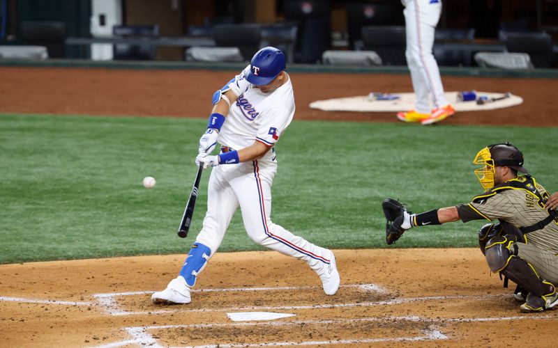 Jul 2, 2024; Arlington, Texas, USA;  Texas Rangers first baseman Nathaniel Lowe (30) hits a two-run home run during the third inning against the San Diego Padres at Globe Life Field. Mandatory Credit: Kevin Jairaj-USA TODAY Sports