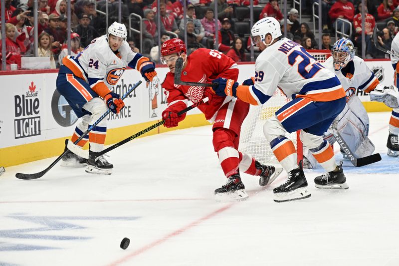 Nov 21, 2024; Detroit, Michigan, USA;  Detroit Red Wings right wing Alex DeBrincat (93) clears the puck away from New York Islanders center Brock Nelson (29) in the second period at Little Caesars Arena. Mandatory Credit: Lon Horwedel-Imagn Images