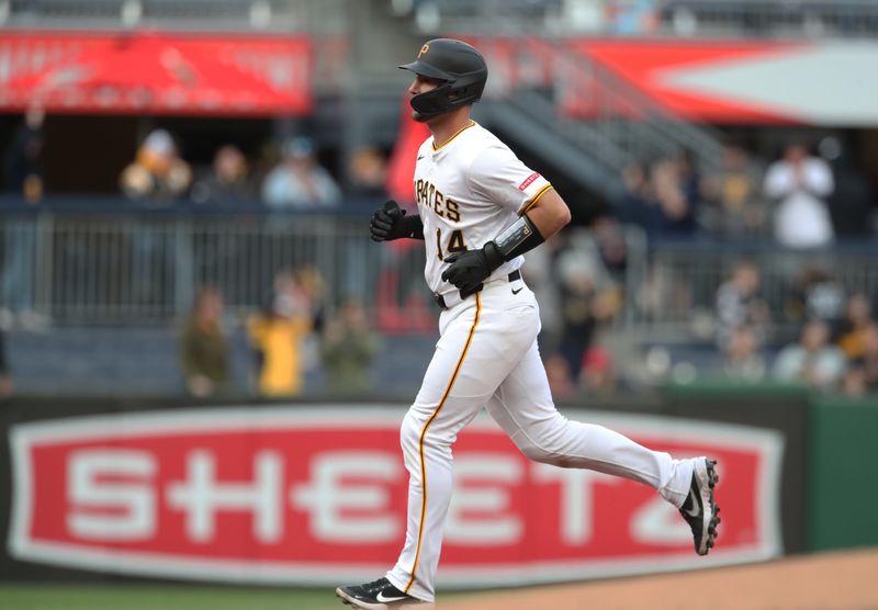 Apr 7, 2025; Pittsburgh, Pennsylvania, USA;  Pittsburgh Pirates catcher Joey Bart (14) circles the bases on a solo home run against the St. Louis Cardinals during the first inning at PNC Park. Mandatory Credit: Charles LeClaire-Imagn Images