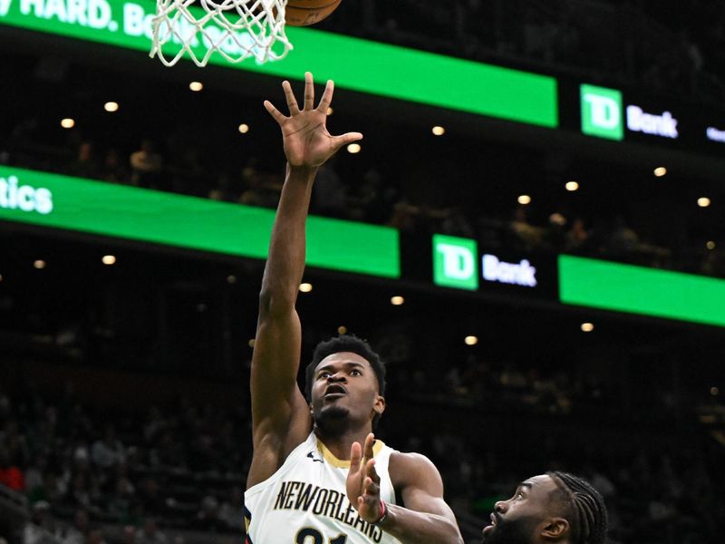 BOSTON, MASSACHUSETTS - JANUARY 12: Yves Missi #21 of the New Orleans Pelicans attempts a shot against Jaylen Brown #7 of the Boston Celtics during the third quarter at the TD Garden on January 12, 2025 in Boston, Massachusetts. NOTE TO USER: User expressly acknowledges and agrees that, by downloading and or using this photograph, User is consenting to the terms and conditions of the Getty Images License Agreement. (Photo by Brian Fluharty/Getty Images)