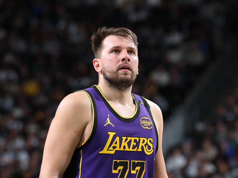 MILWAUKEE, WI - MARCH 13: Luka Doncic #77 of the Los Angeles Lakers shoots a free throw during the game against the Milwaukee Bucks on March 13, 2025 at Fiserv Forum Center in Milwaukee, Wisconsin. NOTE TO USER: User expressly acknowledges and agrees that, by downloading and or using this Photograph, user is consenting to the terms and conditions of the Getty Images License Agreement. Mandatory Copyright Notice: Copyright 2025 NBAE (Photo by Jeff Haynes/NBAE via Getty Images).