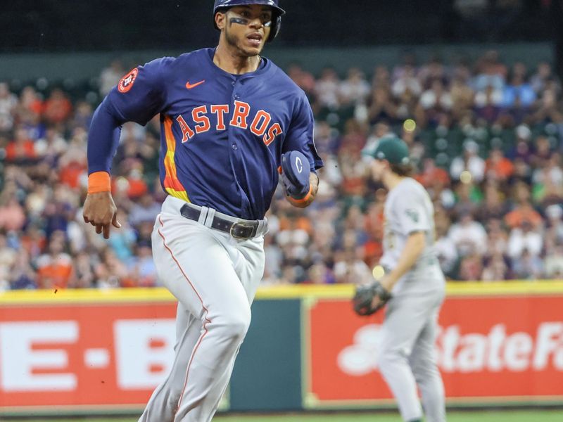 May 15, 2024; Houston, Texas, USA; Houston Astros shortstop Jeremy Pena (3) tags up from second base to third base against the Oakland Athletics in the fourth inning at Minute Maid Park. Mandatory Credit: Thomas Shea-USA TODAY Sports